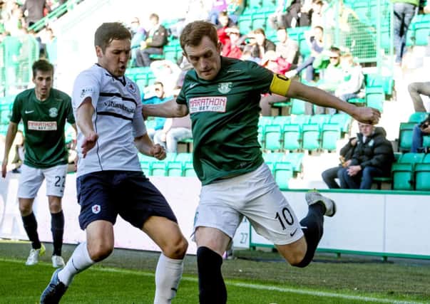 Hibernian's Liam Craig (right) is challenged from Liam Fox. Picture: SNS