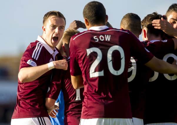 Hearts celebrate as the go 3-0 up. Picture: SNS