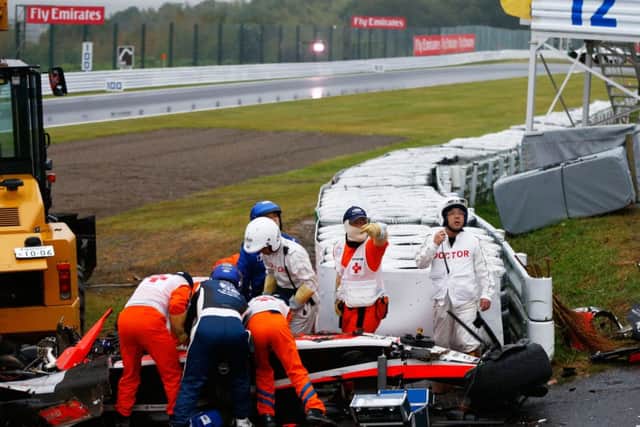 Medics tend to Jules Bianchi after he crashed at Suzuka during the Japanese Grand Prix. Picture: Getty