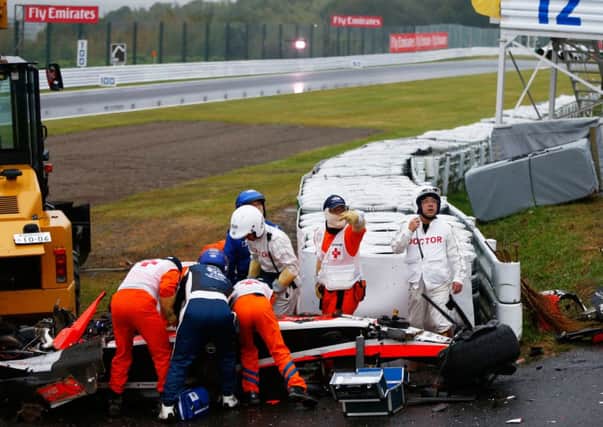 Medics tend to Jules Bianchi after he crashed at Suzuka during the Japanese Grand Prix. Picture: Getty