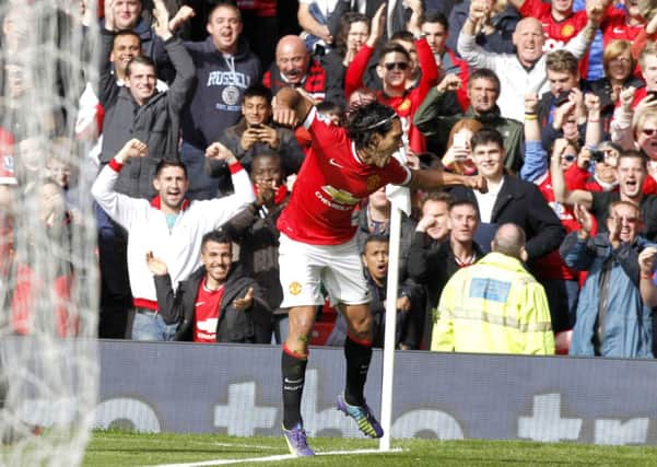 Falcao throws some shapes after nudging the ball over the line for Manchester United's second. Picture: Getty