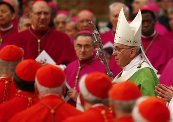 Pope Francis arrives to celebrate a Mass to mark the opening of the synod on the family in Saint Peters, right, in the Vatican. It is the first synod since Francis election. Picture: Reuters