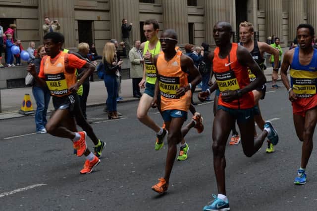 Twice Olympic champion and 2013 Great Scottish Run winner Haile Gebrselassie, left. Picture: SNS