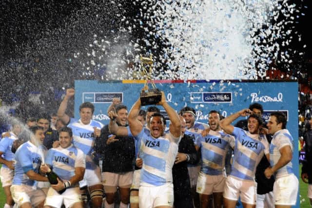 Agustin Creevy lifts the Puma Trophy after Argentinas victory over Australia. Picture: Getty