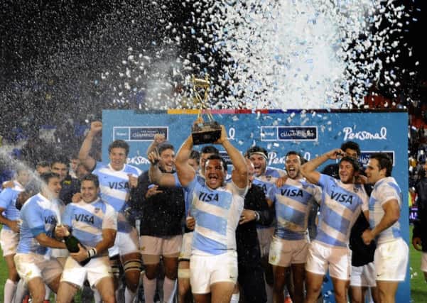 Agustin Creevy lifts the Puma Trophy after Argentinas victory over Australia. Picture: Getty