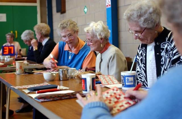 Pensioners play bingo in Sighthill Community Centre in Edinburgh. The capital has come out on top of a retirement savings poll. Picture: Robert Perry
