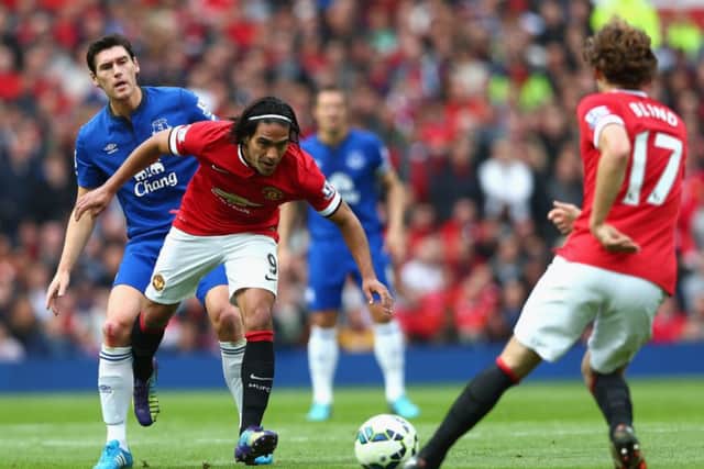 Falcao shrugs off Everton's Gareth Barry as Daley Blind watches on. Picture: Getty