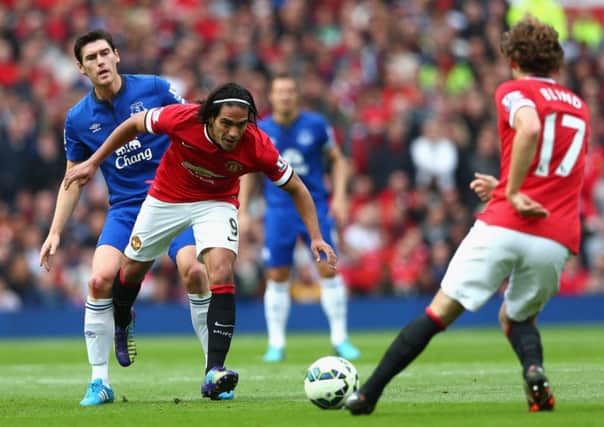 Falcao shrugs off Everton's Gareth Barry as Daley Blind watches on. Picture: Getty