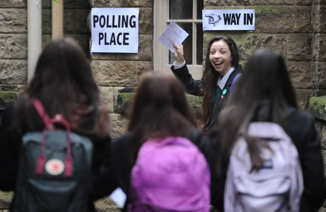 A group of 16-year-old voters make their way to the polling place to vote in the referendum last month. Picture: Neil Hanna