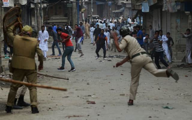 Kashmiri residents and Indian police clash yesterday. Picture: Getty