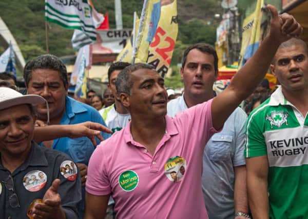 Romario takes part in a campaign rally at the Rocinha favela in Rio de Janeiro in August. Picture: Getty