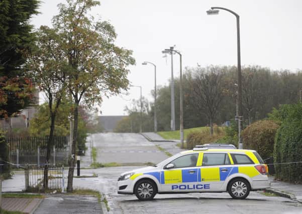 Police seal off the area of West Pilton Park where Jie Yu was stabbed on Wednesday evening. Picture: Greg Macvean