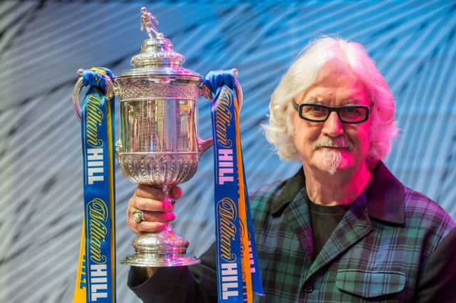 Billy Connolly gets his hands on the Scottish Cup. Picture: Ian Georgeson