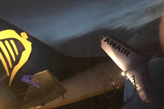 Damage to the tail of one plane and winglet of the other. Picture: . Picture: @EmzCarr