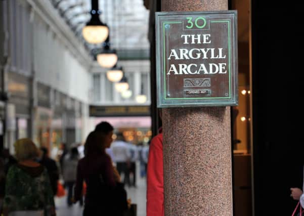 A security guard who guided staff to safety and tried to stop armed robbers at Argyll Arcade has had his pay docked by his employer. Picture: Robert Perry