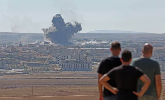 Smoke rises in Kobani following a bombing by the US-led coalition. Picture: Getty