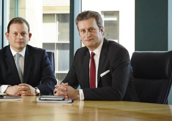 Chief executive Simon Thomson, right, spoke of substantial oil bearing interval. Picture: Complimentary