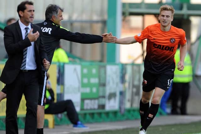 Stuart Armstrong, pictured celebrating with Dundee United coach Darren Jackson after scoring, is a target for Hull. Picture: Ian Rutherford