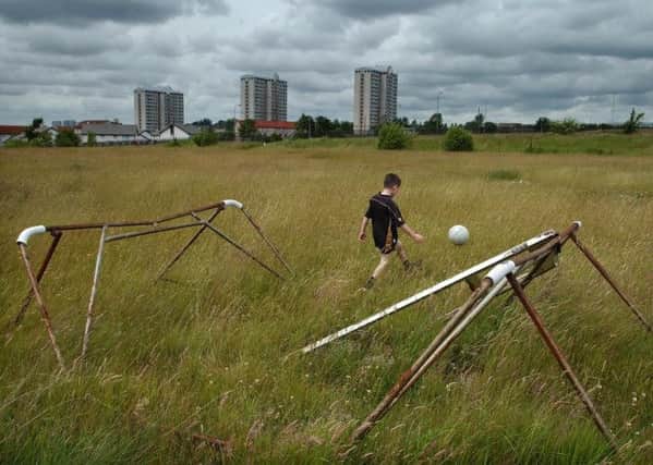 Children living in poverty stricken areas such as Cranhill in Glasgow is one of the factors contributing to Scotland's high child mortality rates. Picture: Robert Perry.