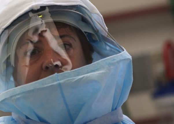 New York Hospital staff member wears protective clothing during a Ebola test demonstration. Picture: Getty