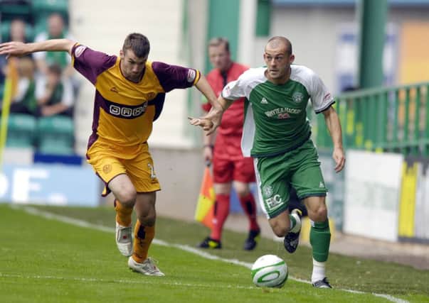 Motherwell's Paul Quinn keeps an eye on Hibs striker Steven Fletcher during an SPL clash in August 2008. Picture: Kenny Smith