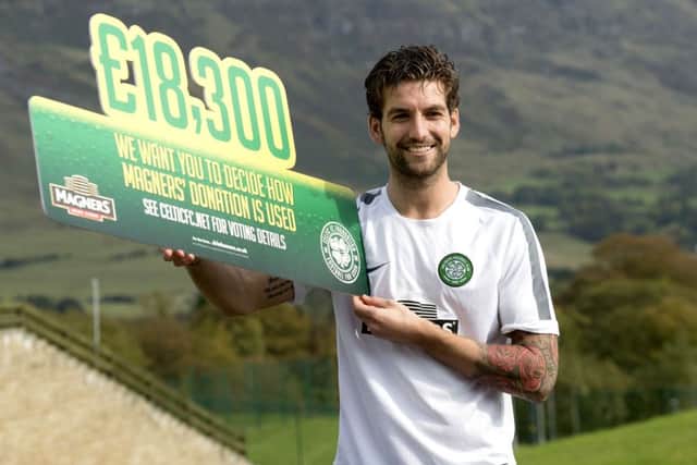 Charlie Mulgrew helps publicise Magners' charity donation to the Celtic FC Foundation. Picture: SNS