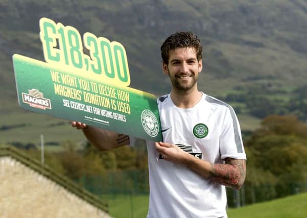 Charlie Mulgrew helps publicise Magners' charity donation to the Celtic FC Foundation. Picture: SNS