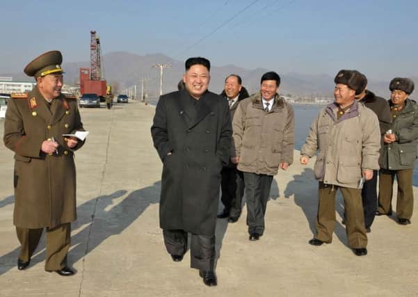 Kim Jong-un on an official visit earlier this year. A source has insisted Kim is still in control of North Korea's government. Picture: AFP