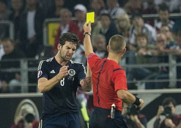 Two harsh yellow cards in Germany left Charlie Mulgrew devastated by the resulting dismissal. Picture: SNS