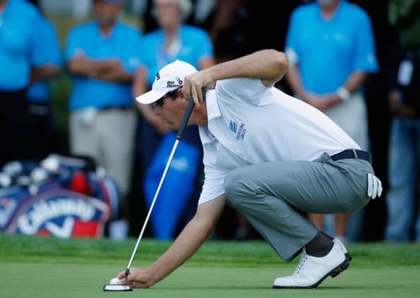 Nicolas Colsaerts lines up the putt on the 18th green that could have made history. Picture: Getty