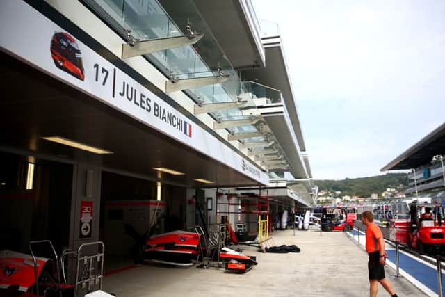 Jules Bianchi of France and Marussia's name is displayed above his side of the team garage. Picture: Getty