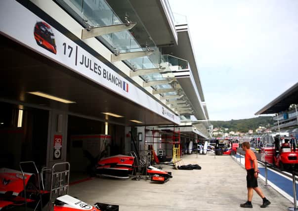 Jules Bianchi of France and Marussia's name is displayed above his side of the team garage. Picture: Getty