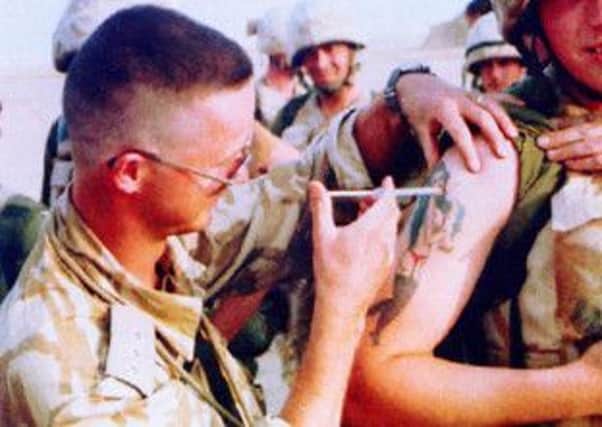 A Scottish soldier receives an injection to counter the effects of chemical attack during the Gulf War. Picture: PA