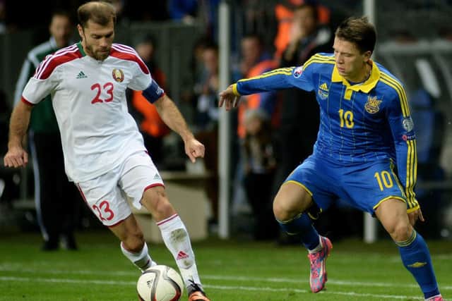 Belarus midfielder Timofei Kalachev (L) fights for the ball with Ukraine forward Yevhen Konoplyanka. Picture: Getty