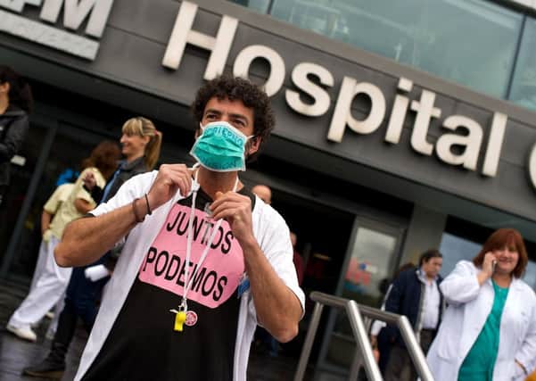 Protesters claim cutbacks had led to a nurse in Spain being infected. Picture: Getty