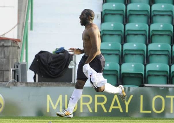 Christian Nade celebrates his equalizer and taunts the Hibs fans. Picture: Greg Macvean