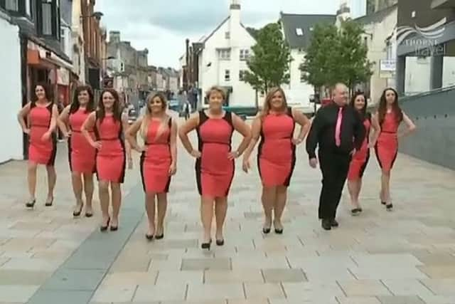 Thorne Travel staff march down Kilwinning high street. Picture: Hemedia