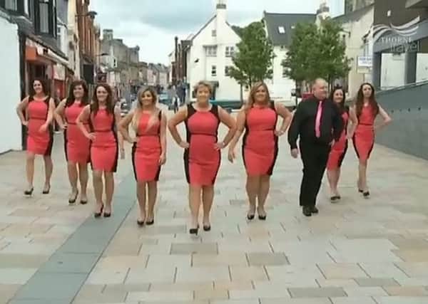 Thorne Travel staff march down Kilwinning high street. Picture: Hemedia