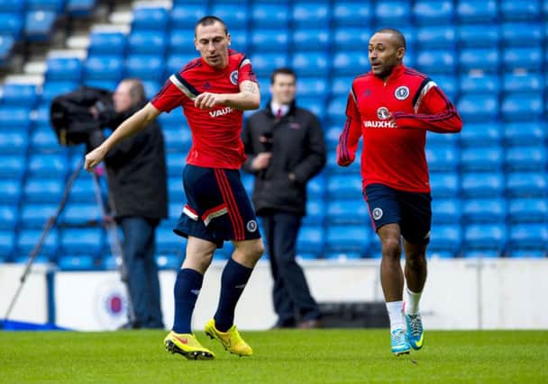Scott Brown, left, and Ikechi Anya are put through their paces yesterday. Picture: SNS