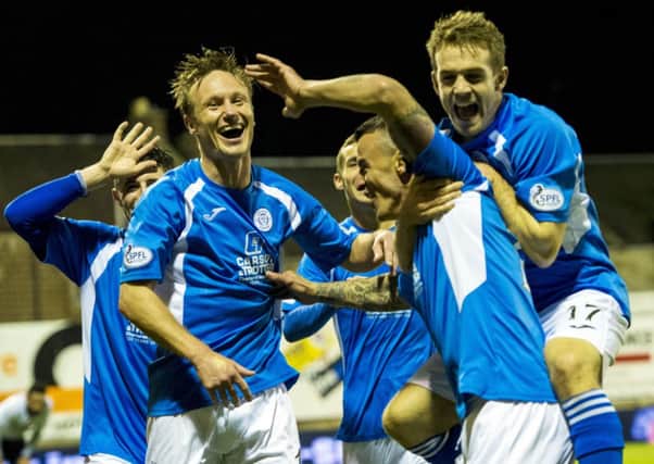 Queen of the South celebrate Derek Lyle's goal. Picture: SNS