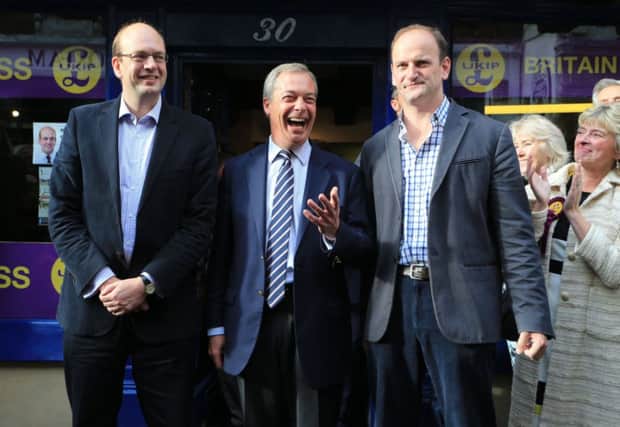 Nigel Farage, centre, Douglas Carswell MP, right, and Ukip hopeful Mark Reckless in Rochester. Picture: PA