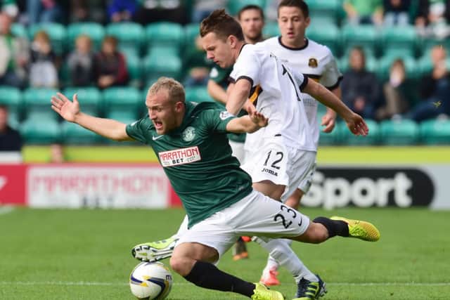 Dylan McGeouch is challenged by Scott Taggart. Picture: SNS