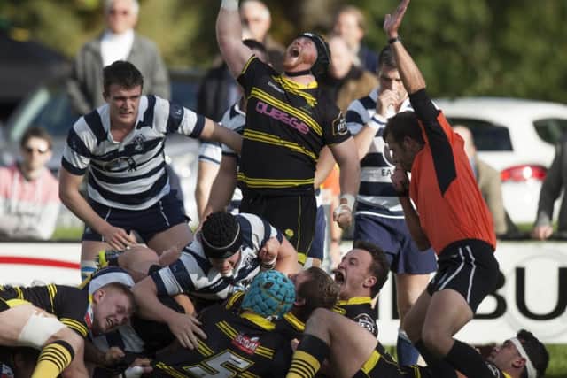 Ewan McQuillin celebrates Tod Pearces try for Melrose against Heriots at the Greenyards yesterday. Picture: Toby Williams