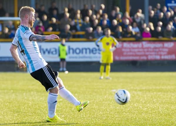 Adam Eckersley fires in the free kick he scored from at Alloa last Saturday. Picture: SNS