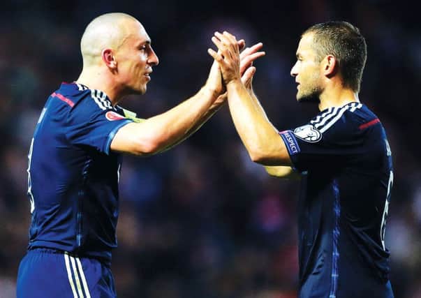 Shaun Maloney celebrates at full time with captain Scott Brown. Picture: PA