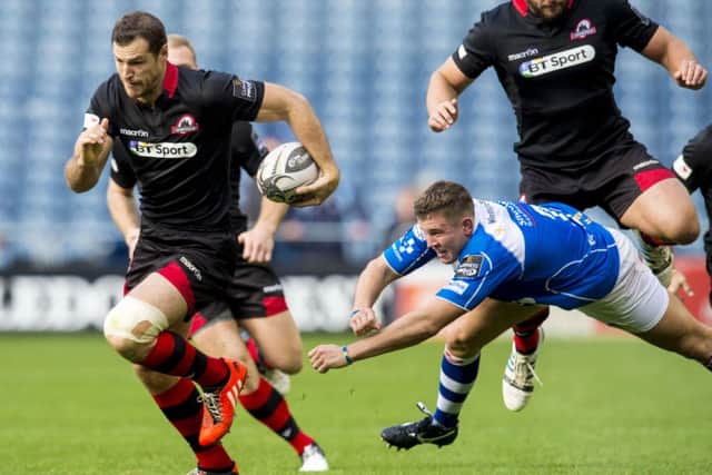 Edinburgh's Tim Visser (left) gets away from Elliot Dee. Picture: SNS