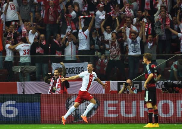 Poland's forward Arkadiusz Milik celebrates giving his team the lead. Picture: Getty