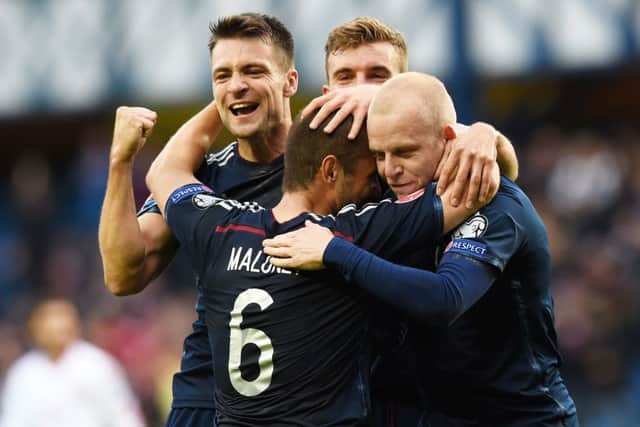 Shaun Maloney is mobbed after his effort is bundled into the net courtesy of Akaki Khubutia. Picture: SNS