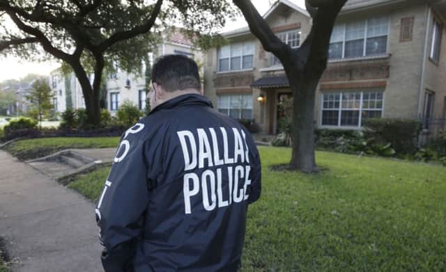 Police stand guard outside the Dallas apartment of the infected healthcare worker. Picture: AP