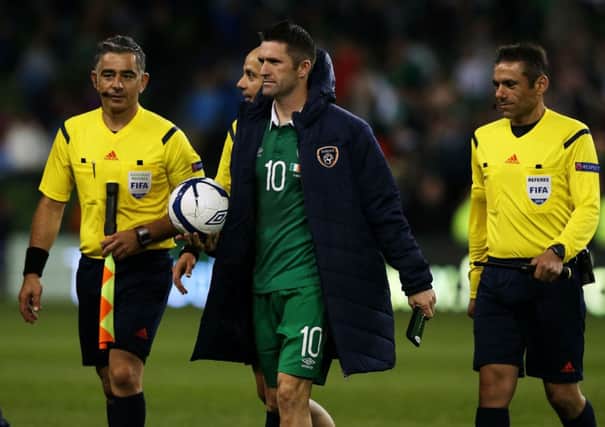 Robbie Keane carries off the match ball after scoring  a hat-trick in Irelands 7-0 destruction of Gibraltar. Picture:PA